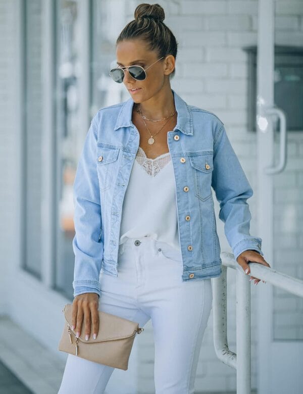 Fitted women's denim jacket front view, long sleeves, stylish design