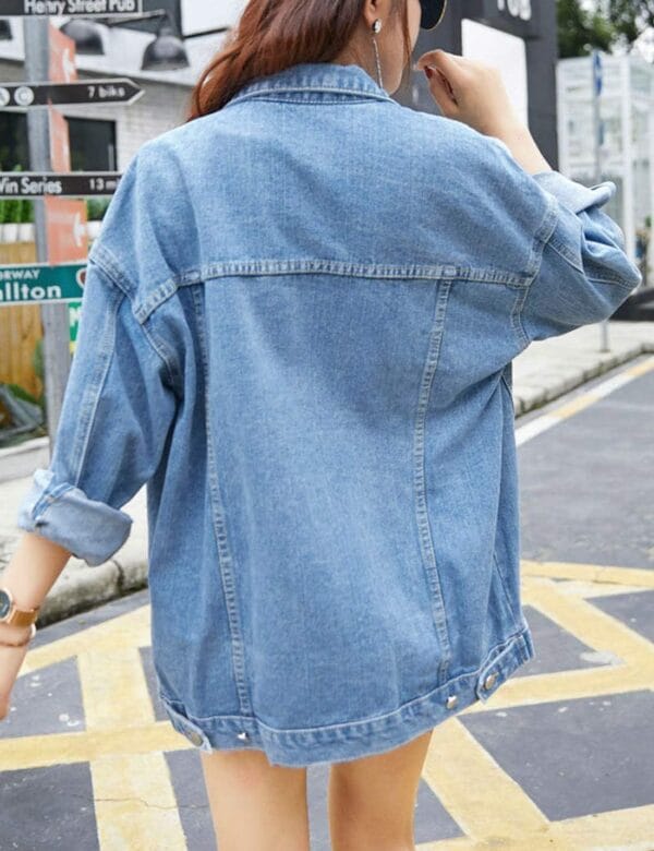 Oversized denim jacket for women with front button closure and pockets