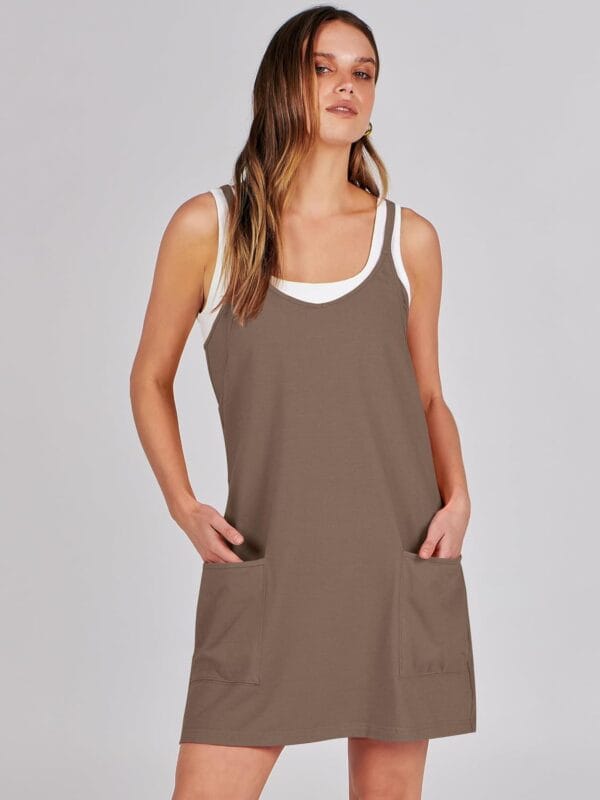 Women's summer tennis dress in white with built-in shorts, front view