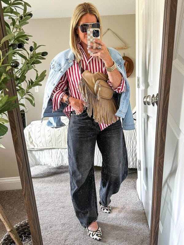 Women's fitted long sleeve denim jacket in light wash front view