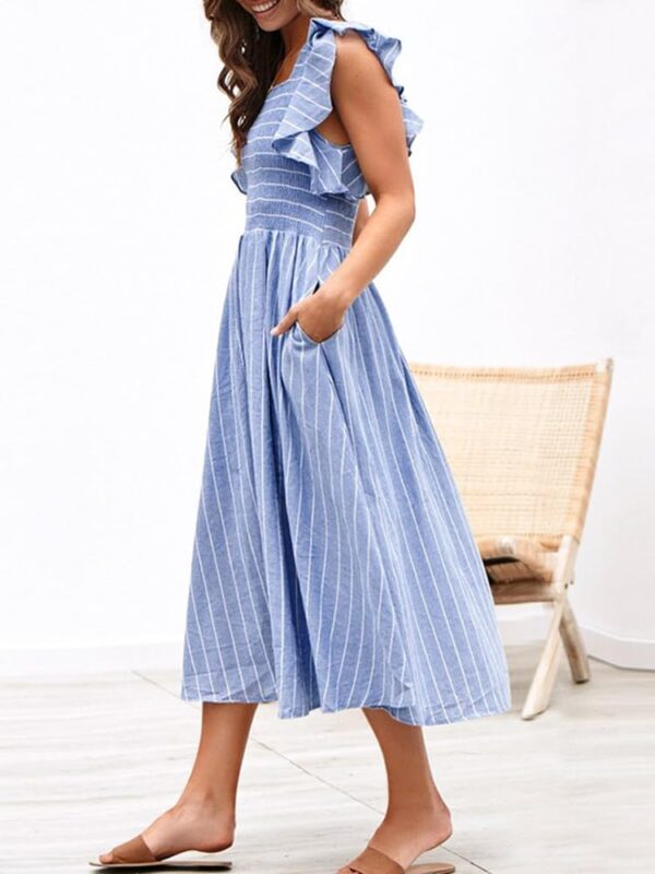 Women's smocked linen midi dress with pockets in summer setting