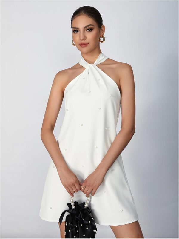 Women's halter neck cocktail dress featuring intricate beadwork and an A-line silhouette