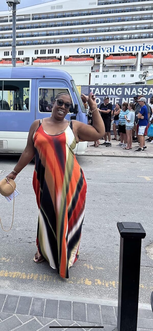 Floral plus size maxi dress casual with pockets on model outdoors