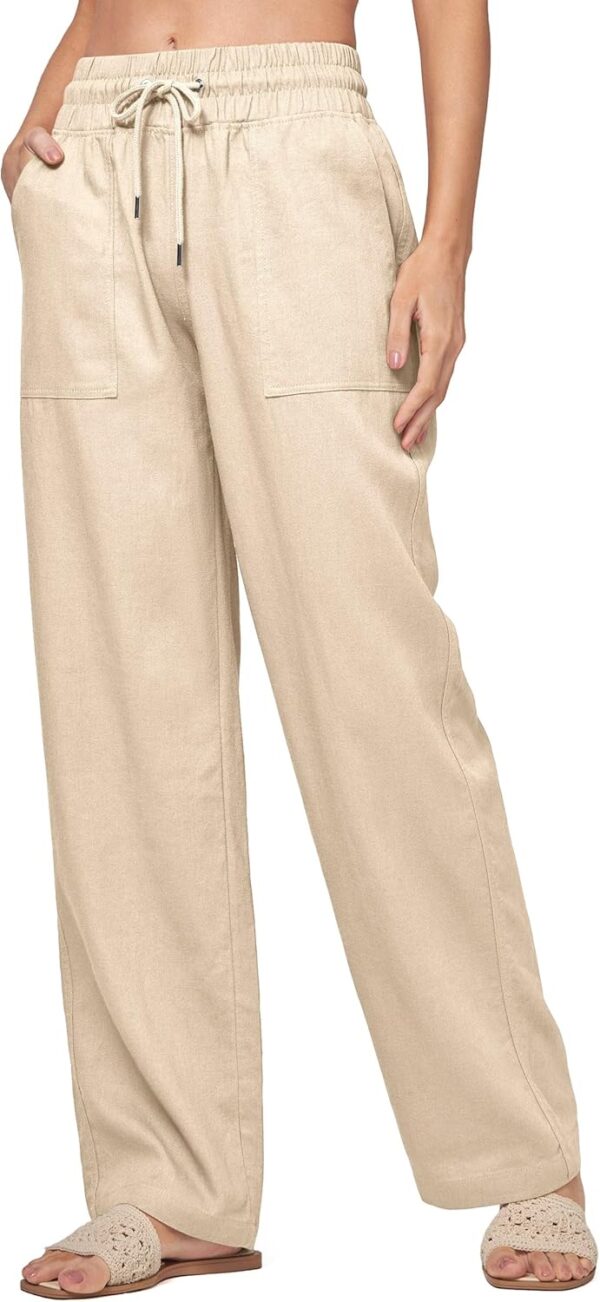 Model wearing women's wide leg linen beach pants with pockets in sunlight