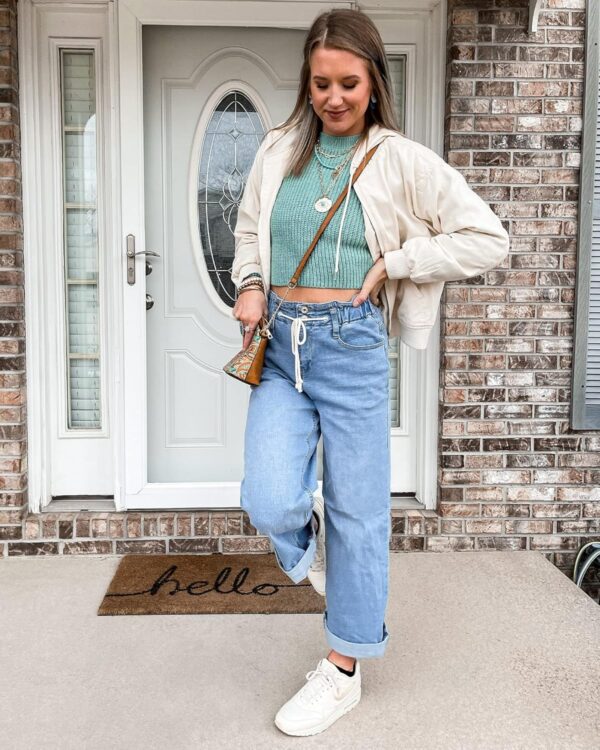 Women wearing stretchy high waisted wide leg jeans, side view